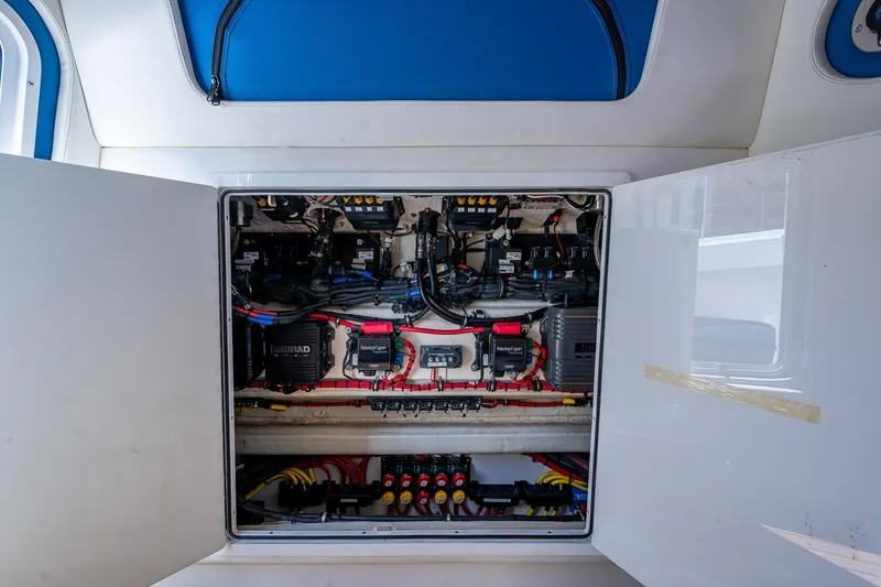 Slide: The Image of Electrical panel inside a 2020 Front Runner 39 boat, showcasing wiring and components. - 26