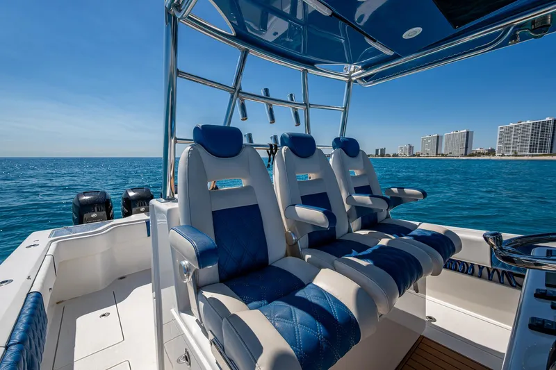 Slide: The Image of Luxury seating on a 2020 Front Runner 39 boat, with ocean and city skyline backdrop. - 28