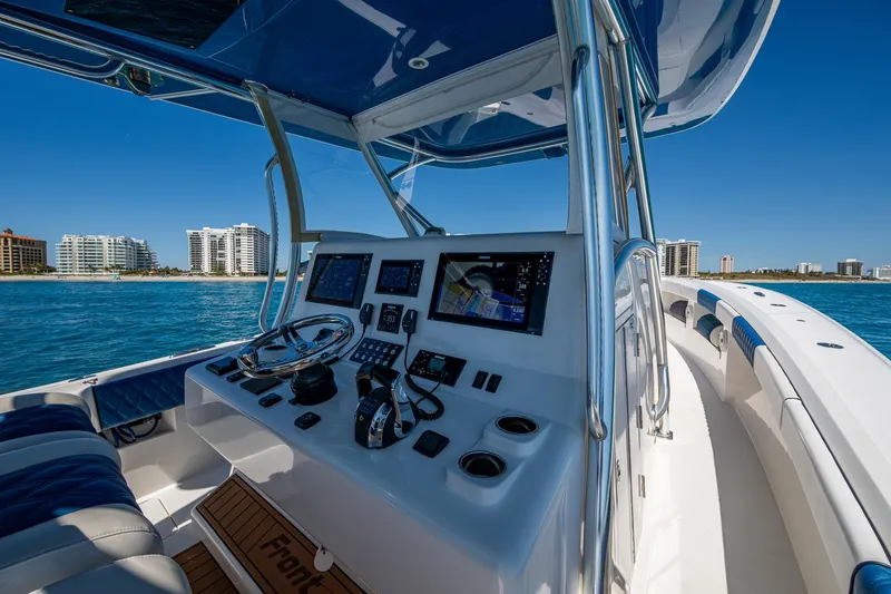 Slide: The Image of Cockpit view of 2020 Front Runner 39 boat with modern navigation equipment, ocean backdrop. - 29