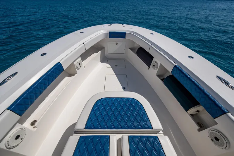 Slide: The Image of Front Runner 39 boat interior with blue seating, 2020 model, on clear blue water. - 3