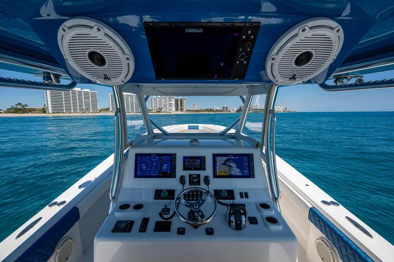 Slide: The Image of 2020 Front Runner 39 boat dashboard with ocean view and modern navigation equipment. - 33