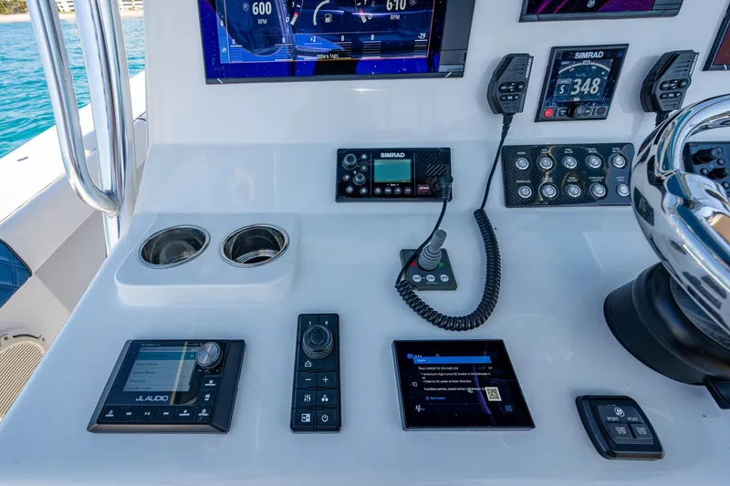 Slide: The Image of Control panel of a 2020 Front Runner 39 boat with navigation and communication devices. - 34