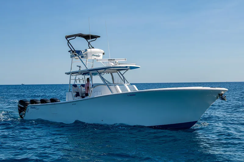 Slide: The Image of 2020 Front Runner 39 boat cruising on open sea under clear blue sky. - 36