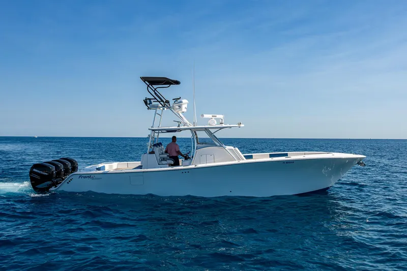 Slide: The Image of 2020 Front Runner 39 boat cruising on open sea with clear blue skies. - 38