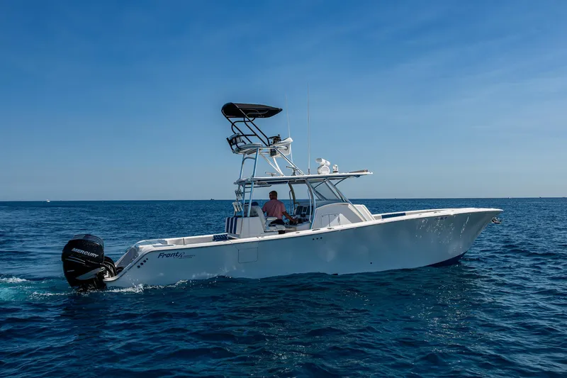 Slide: The Image of Front Runner 39 boat cruising on open sea, 2020 model, clear blue sky. - 39