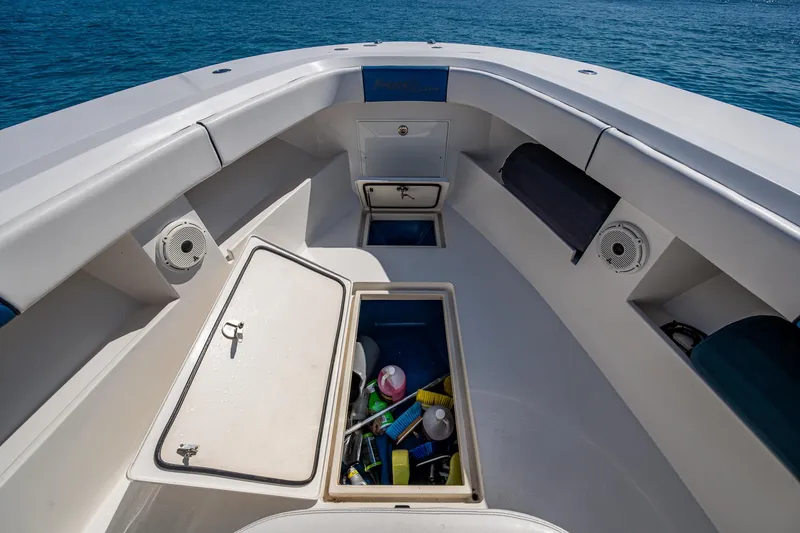 Slide: The Image of Front Runner 39 boat interior, open storage compartments, ocean view, 2020 model. - 4