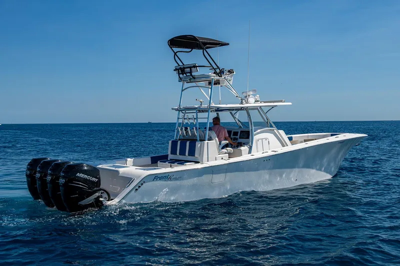 Slide: The Image of 2020 Front Runner 39 boat on open sea with multiple outboard engines. - 40