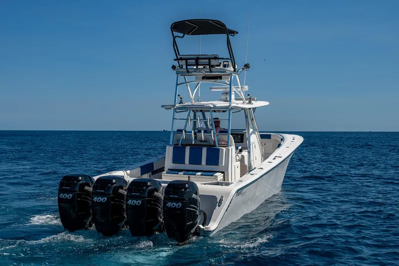 Slide: The Image of Front Runner 39 boat, 2020 model, with four powerful engines cruising on open water. - 42