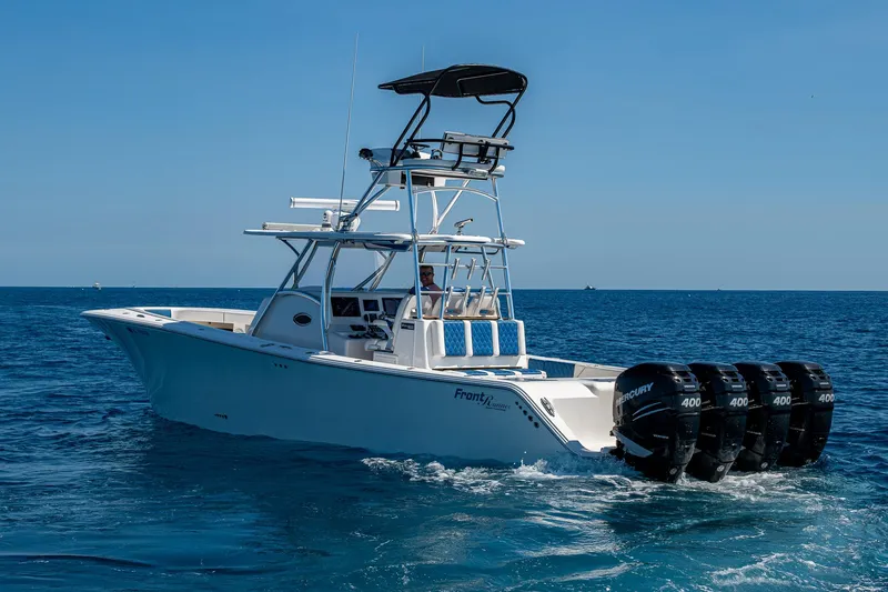 Slide: The Image of 2020 Front Runner 39 boat with multiple outboard motors cruising on open water. - 44