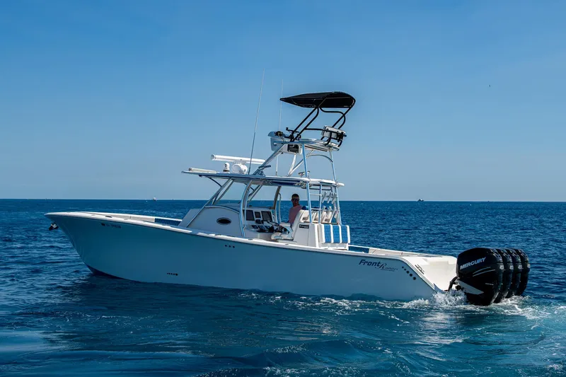 Slide: The Image of 2020 Front Runner 39 boat cruising on open sea with clear blue sky. - 45