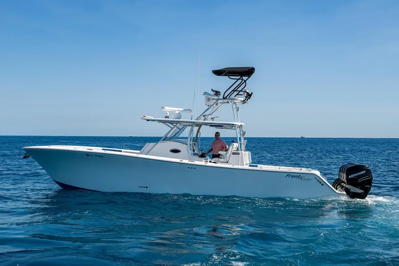 Slide: The Image of 2020 Front Runner 39 boat cruising on open water under clear blue sky. - 46