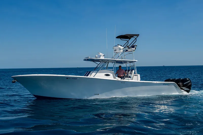 Slide: The Image of Front Runner 39 boat cruising on open sea, 2020 model, clear blue sky. - 47