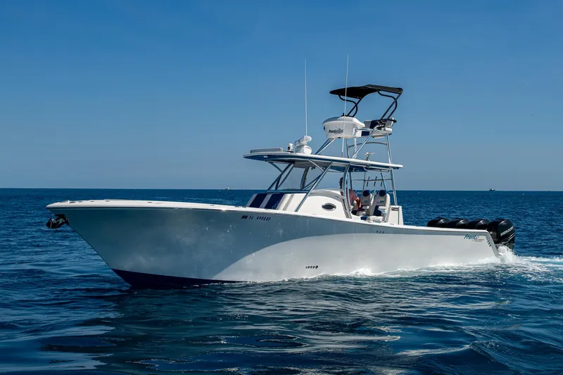 Slide: The Image of 2020 Front Runner 39 boat cruising on open water under clear blue sky. - 48