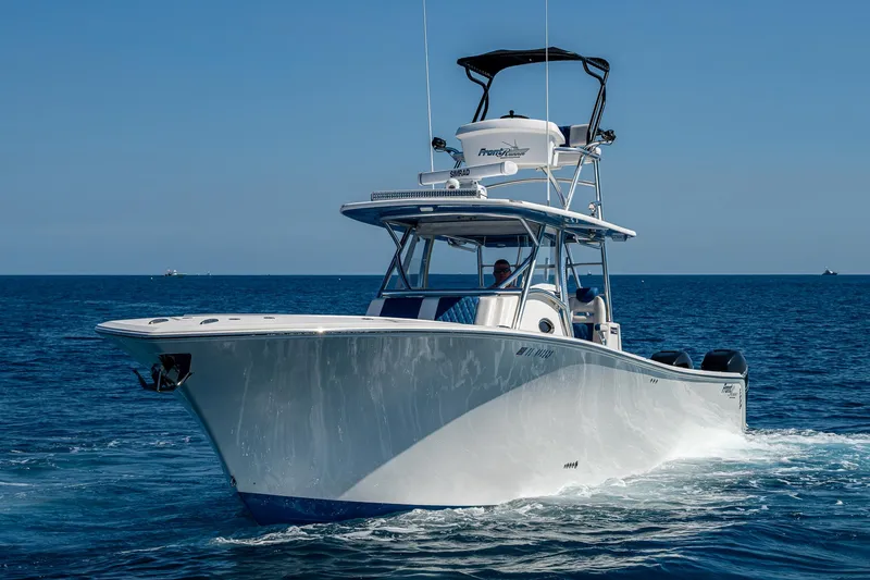 Slide: The Image of Front Runner 39 boat cruising on open sea, 2020 model, clear blue sky. - 49