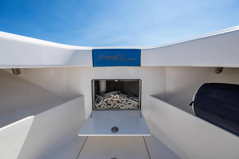 Slide: The Image of Front Runner 39 boat storage compartment with rope, 2020 model, under clear blue sky. - 5