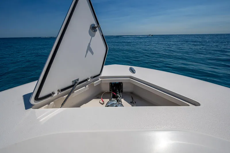 Slide: The Image of Front Runner 39 boat anchor compartment open on calm ocean, 2020 model. - 6