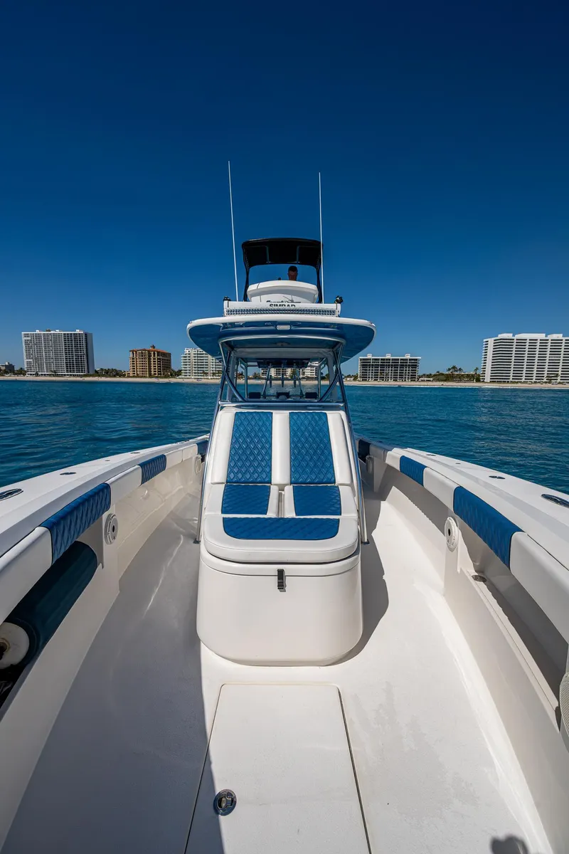 Slide: The Image of 2020 Front Runner 39 boat on water with city skyline in background. - 8
