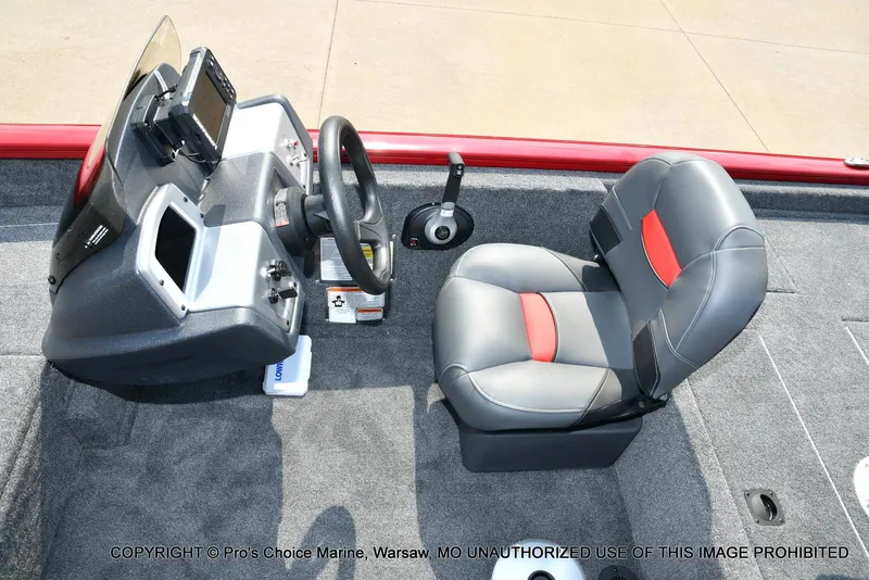 Slide: The Image of 2025 Tracker Pro Team 175 Crappie Edition boat interior with steering console and seat. - 11