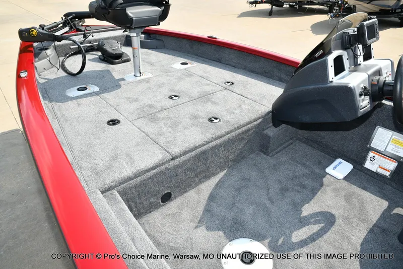 Slide: The Image of 2025 Tracker Pro Team 175 Crappie Edition boat interior with red trim and fishing equipment. - 12