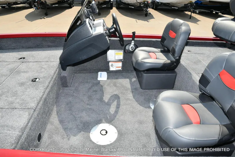 Slide: The Image of 2025 Tracker Pro Team 175 Crappie Edition boat interior with gray and red seating. - 13
