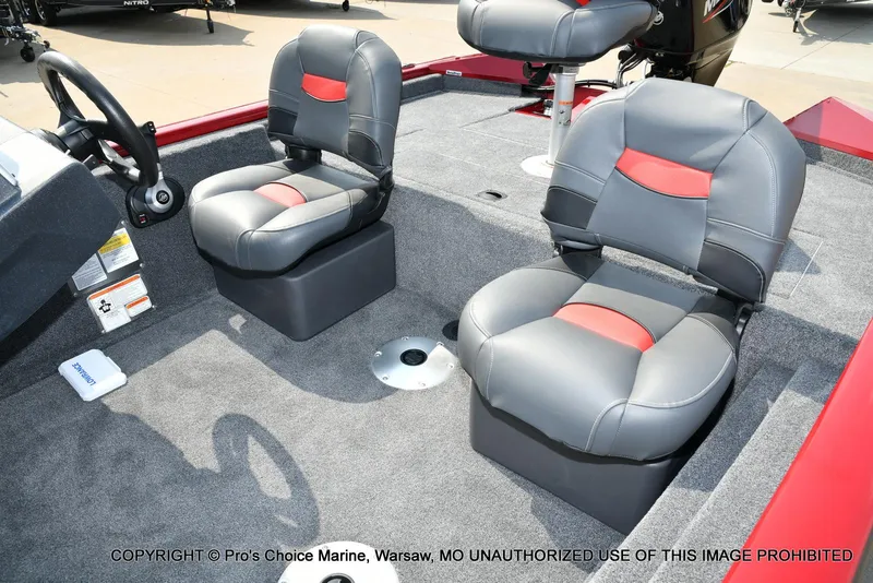 Slide: The Image of 2025 Tracker Pro Team 175 Crappie Edition boat interior with gray and red seating. - 14