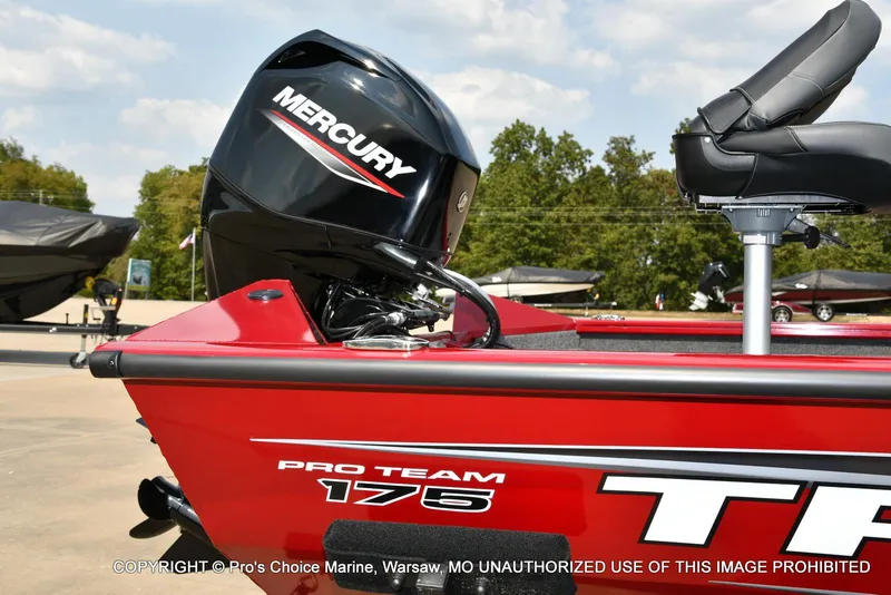 Slide: The Image of 2025 Tracker Pro Team 175 Crappie Edition boat with Mercury engine, red exterior. - 15