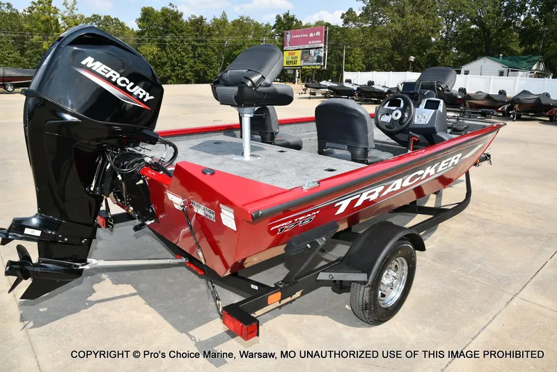 Slide: The Image of 2025 Tracker Pro Team 175 Crappie Edition boat with Mercury engine, parked outdoors. - 16