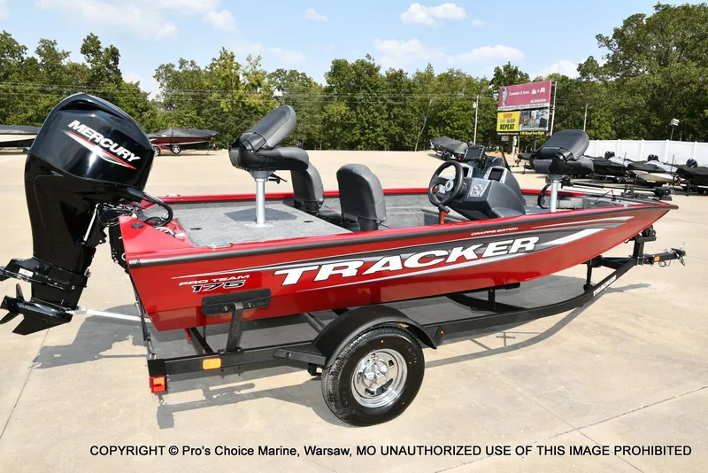 Slide: The Image of 2025 Tracker Pro Team 175 Crappie Edition boat with Mercury engine, parked outdoors. - 17
