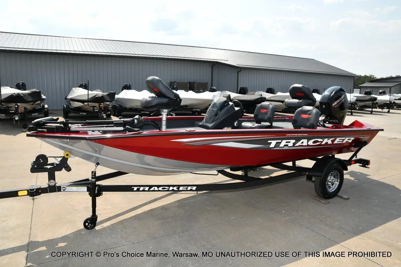 Slide: The Image of 2025 Tracker Pro Team 175 Crappie Edition boat in red, parked on a trailer. - 23