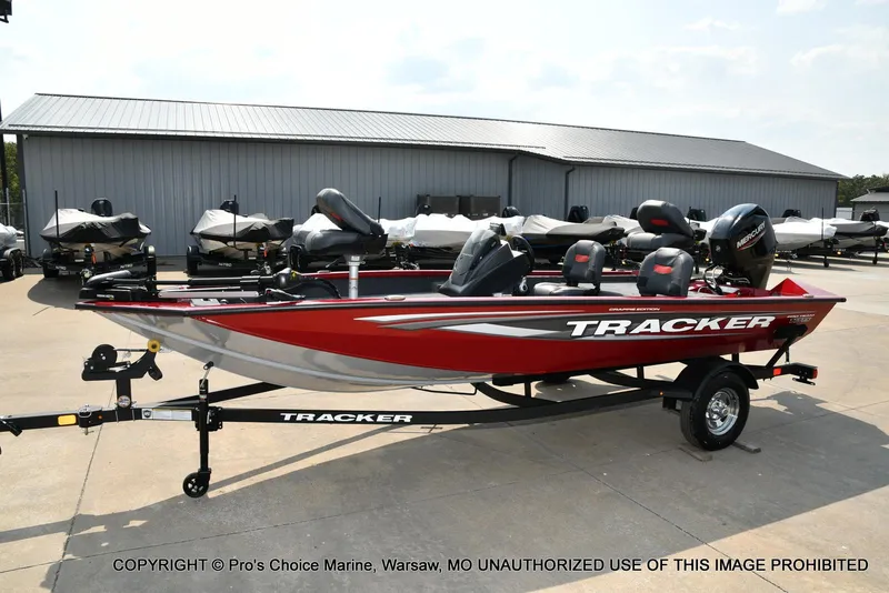 Slide: The Image of 2025 Tracker Pro Team 175 Crappie Edition boat in red, parked on a trailer. - 24