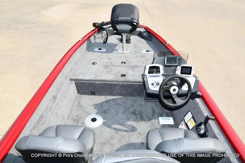 Slide: The Image of 2025 Tracker Pro Team 175 Crappie Edition boat interior with steering console and seating. - 35
