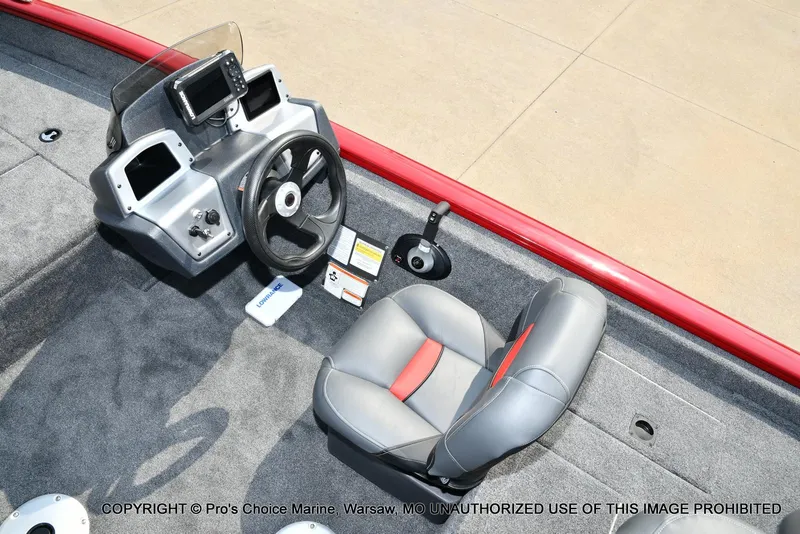 Slide: The Image of 2025 Tracker Pro Team 175 Crappie Edition boat interior with steering wheel and seat. - 36