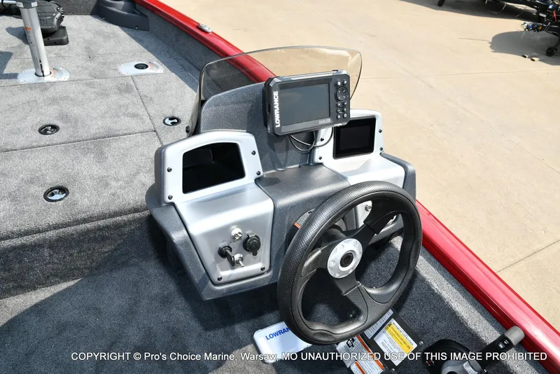 Slide: The Image of 2025 Tracker Pro Team 175 Crappie Edition boat dashboard with steering wheel and navigation system. - 37