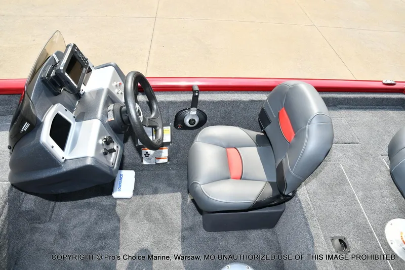 Slide: The Image of 2025 Tracker Pro Team 175 Crappie Edition boat interior with steering console and seating. - 38
