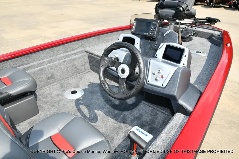 Slide: The Image of 2025 Tracker Pro Team 175 Crappie Edition boat interior with steering wheel and navigation equipment. - 4