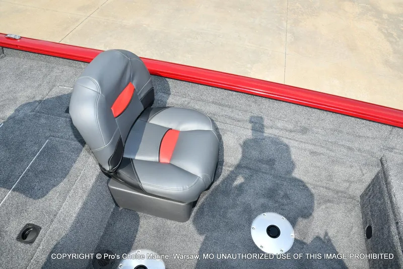 Slide: The Image of 2025 Tracker Pro Team 175 Crappie Edition boat seat with red accents on gray upholstery. - 41