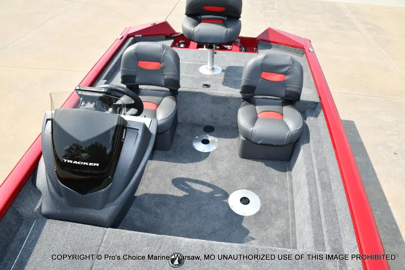 Slide: The Image of 2025 Tracker Pro Team 175 Crappie Edition boat interior with seating and steering console. - 46