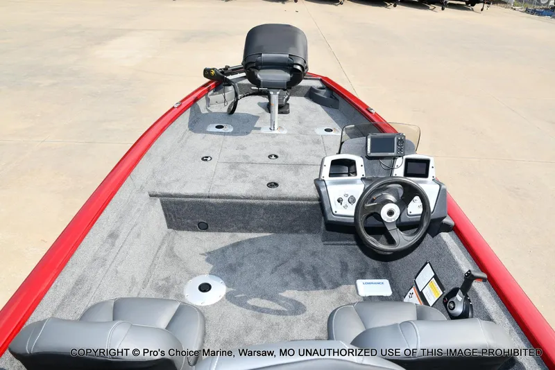 Slide: The Image of 2025 Tracker Pro Team 175 Crappie Edition boat interior with steering wheel and seating. - 6