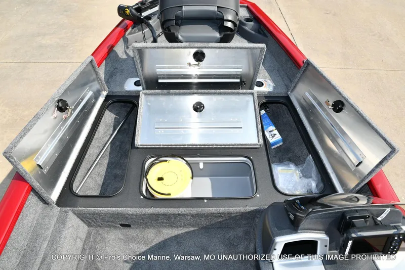 Slide: The Image of 2025 Tracker Pro Team 175 Crappie Edition boat with open storage compartments. - 7