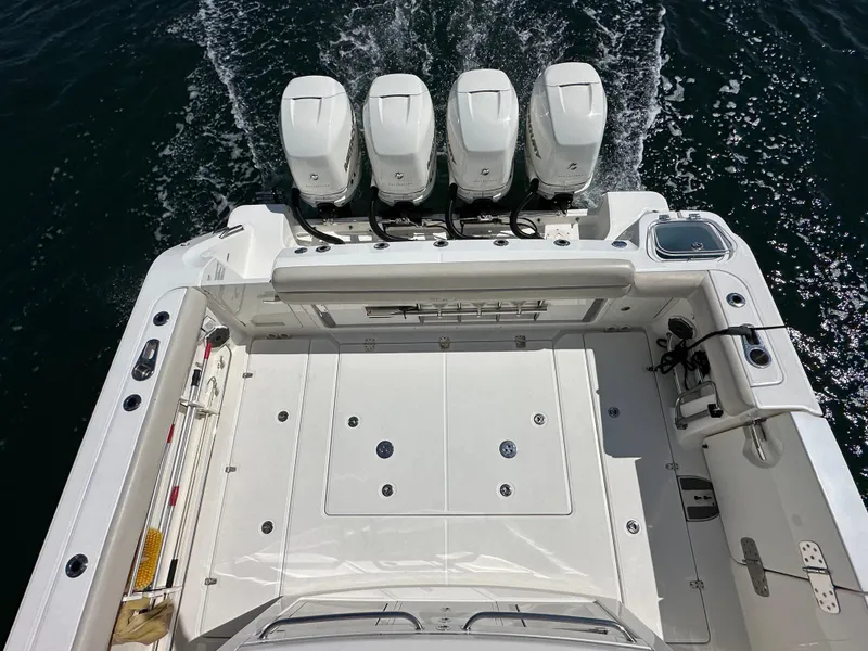 Slide: The Image of 2020 Boston Whaler 420 Outrage boat with four powerful engines on the water. - 16