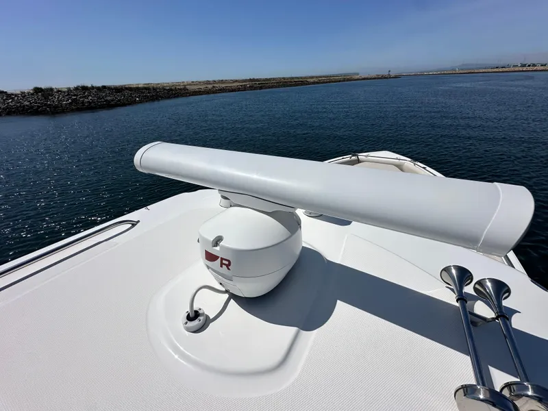 Slide: The Image of 2020 Boston Whaler 420 Outrage radar and horn on deck, overlooking calm waters. - 18