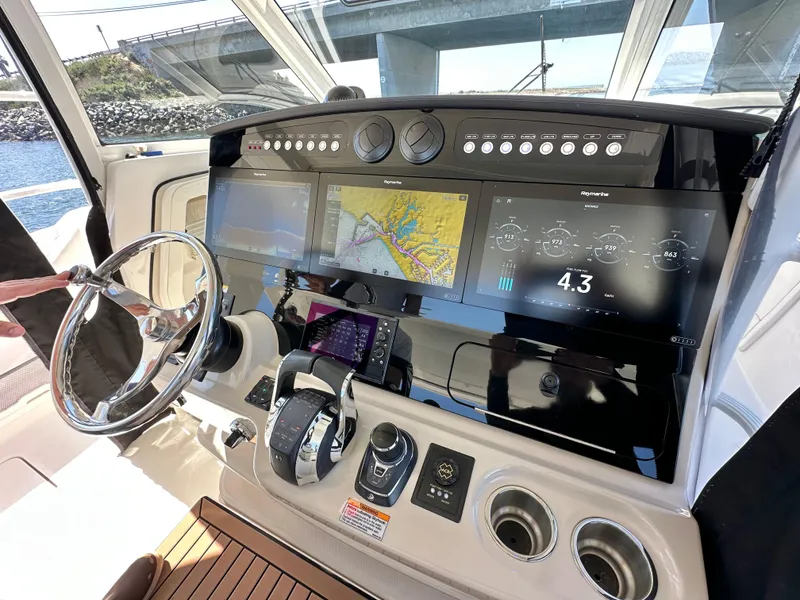 Slide: The Image of 2020 Boston Whaler 420 Outrage helm with advanced navigation and control systems. - 21