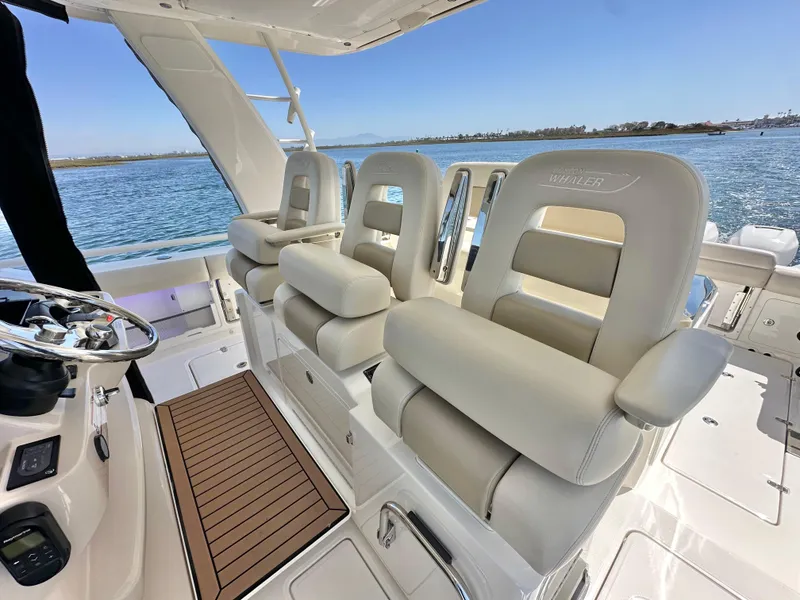 Slide: The Image of 2020 Boston Whaler 420 Outrage interior with luxurious seating and ocean view. - 29