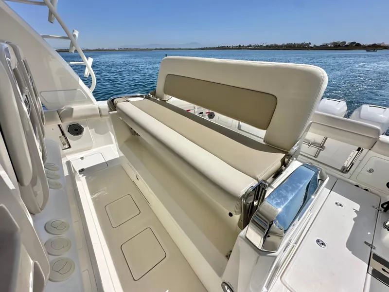 Slide: The Image of 2020 Boston Whaler 420 Outrage boat interior with seating, on a sunny day. - 30