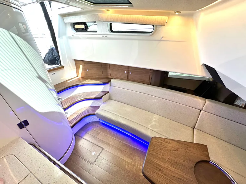 Slide: The Image of Luxurious interior of 2020 Boston Whaler 420 Outrage with modern seating and ambient lighting. - 47