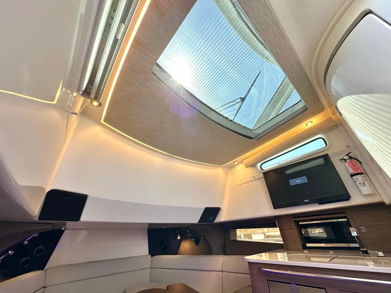 Slide: The Image of Luxurious interior of 2020 Boston Whaler 420 Outrage with skylight and modern amenities. - 48