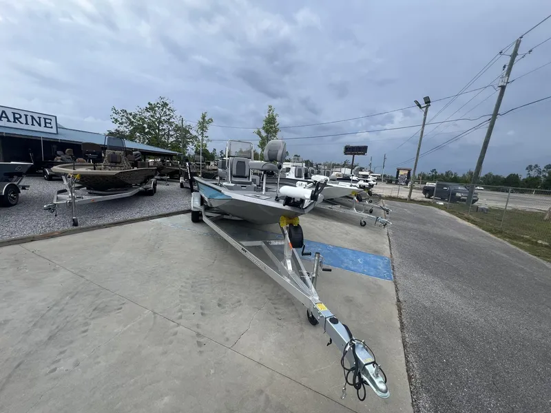 Slide: The Image of 2025 Xpress Hyper-Lift Series H22B boat on trailer at dealership lot. - 2