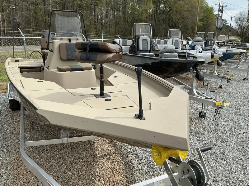 Slide: The Image of 2025 Excel Bay Pro 203 ELITE boat on trailer, displayed outdoors. - 2