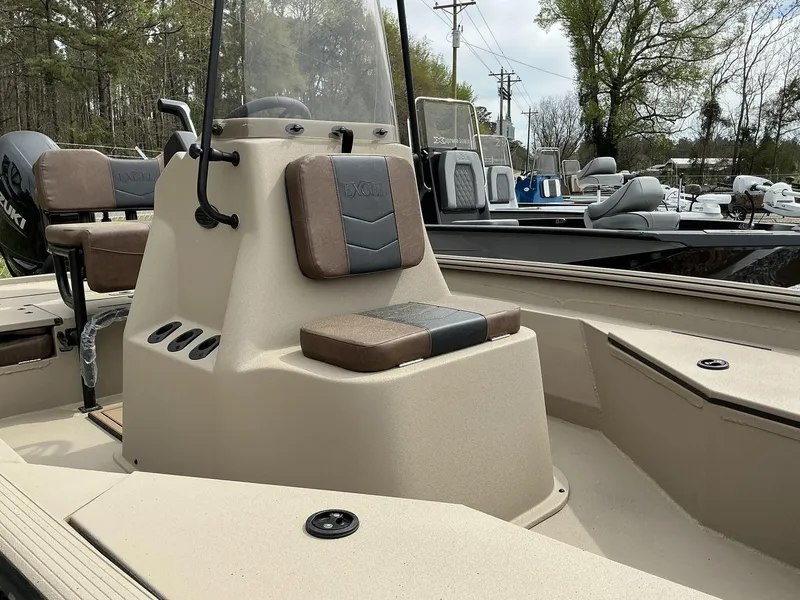 Slide: The Image of 2025 Excel Bay Pro 203 ELITE boat interior with seating and console. - 3