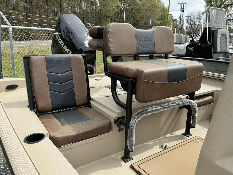 Slide: The Image of 2025 Excel Bay Pro 203 Elite boat seats with Suzuki engine in background. - 9